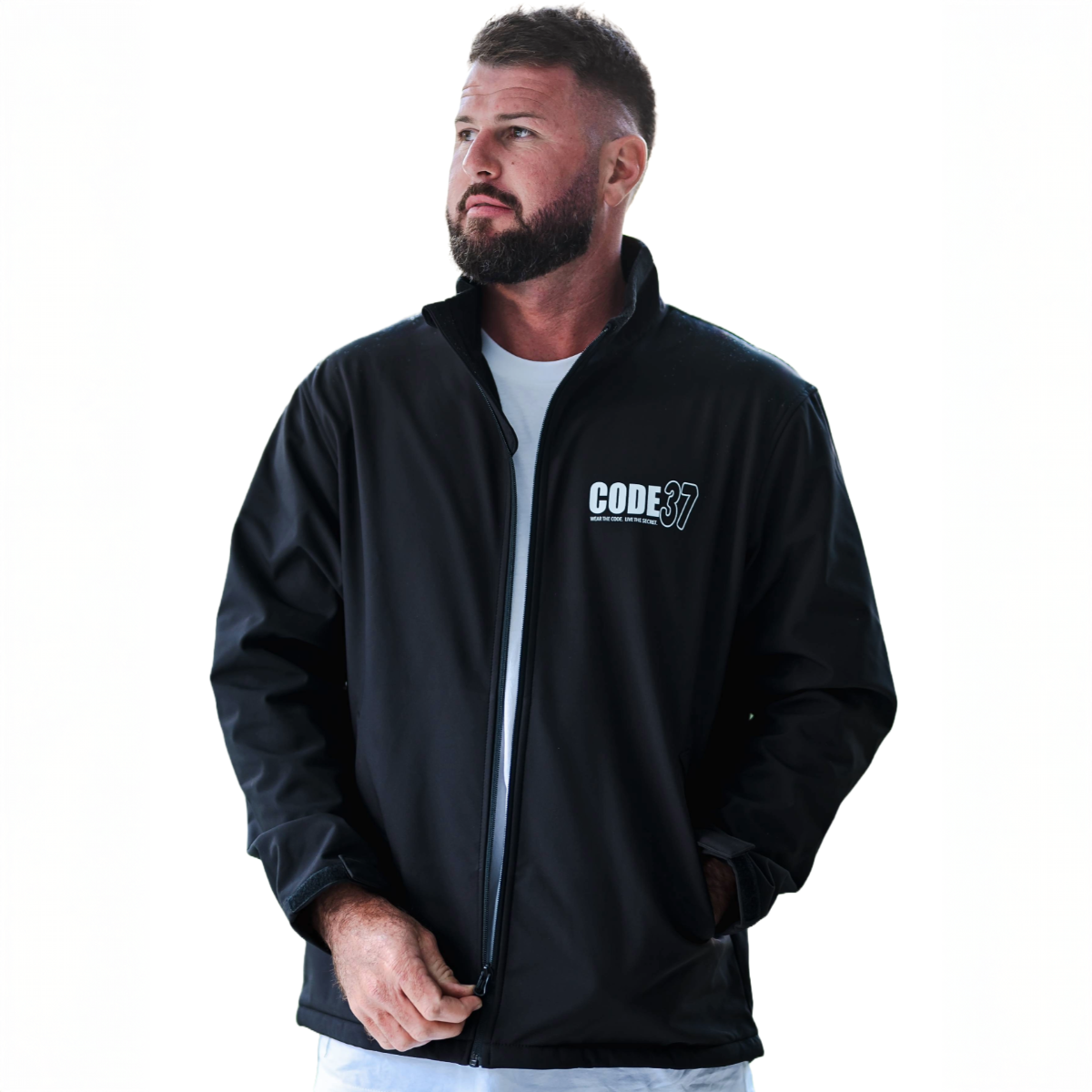 Man wearing a black jacket with 'CODE 37' logo on a white background