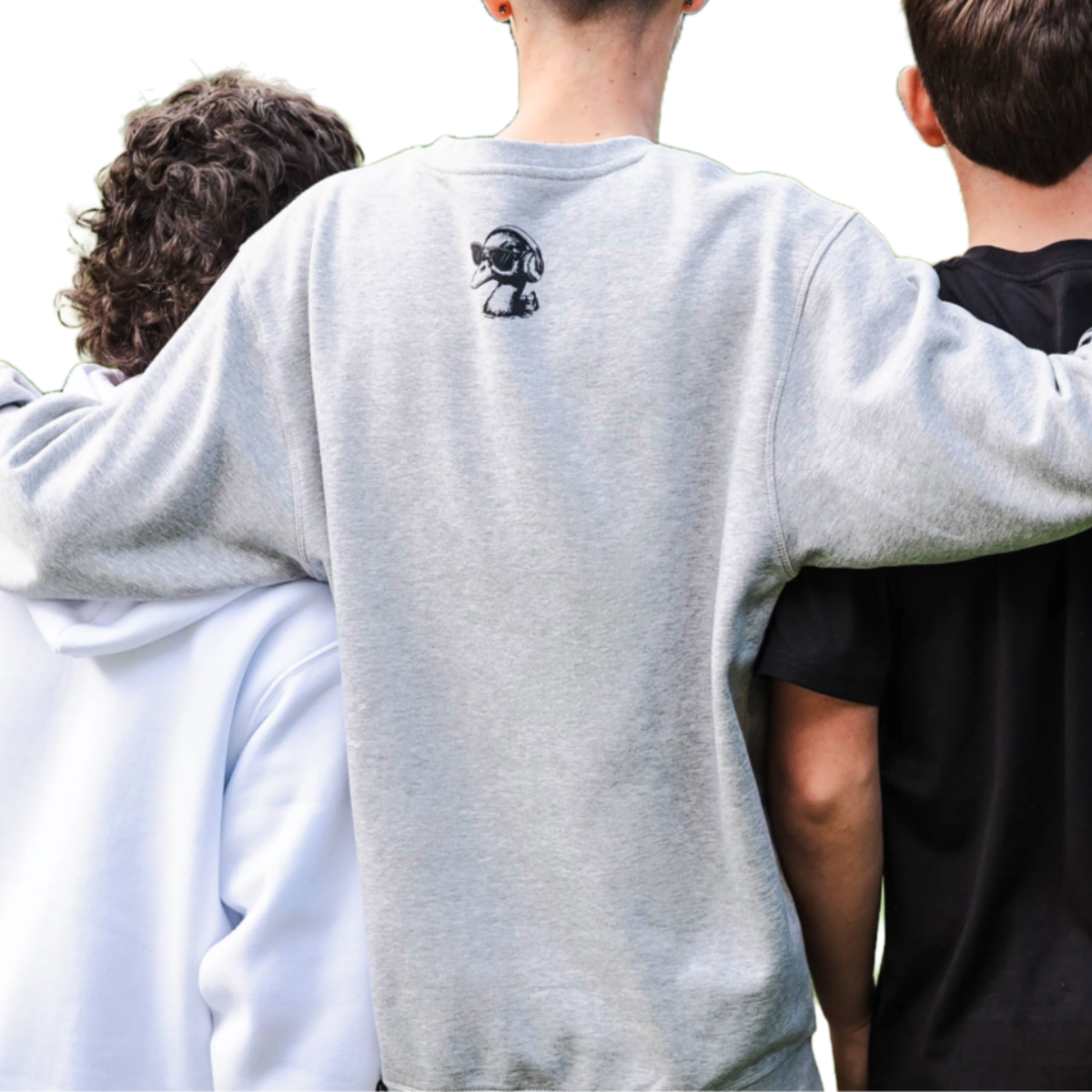 Three people standing close together with a focus on the back of one person wearing a gray sweatshirt with a design.