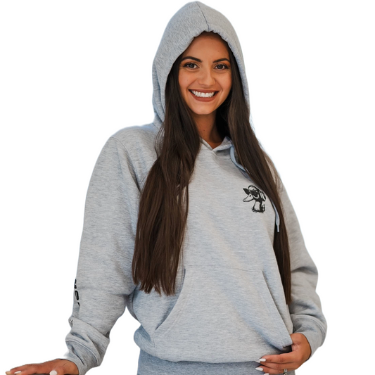 Woman wearing a gray hoodie with a small logo on a white background