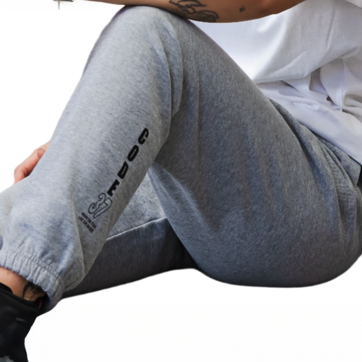 Gray sweatpants with branding on a white background