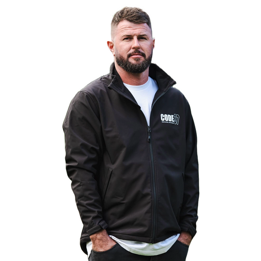 Man wearing a black jacket with a logo on a white background