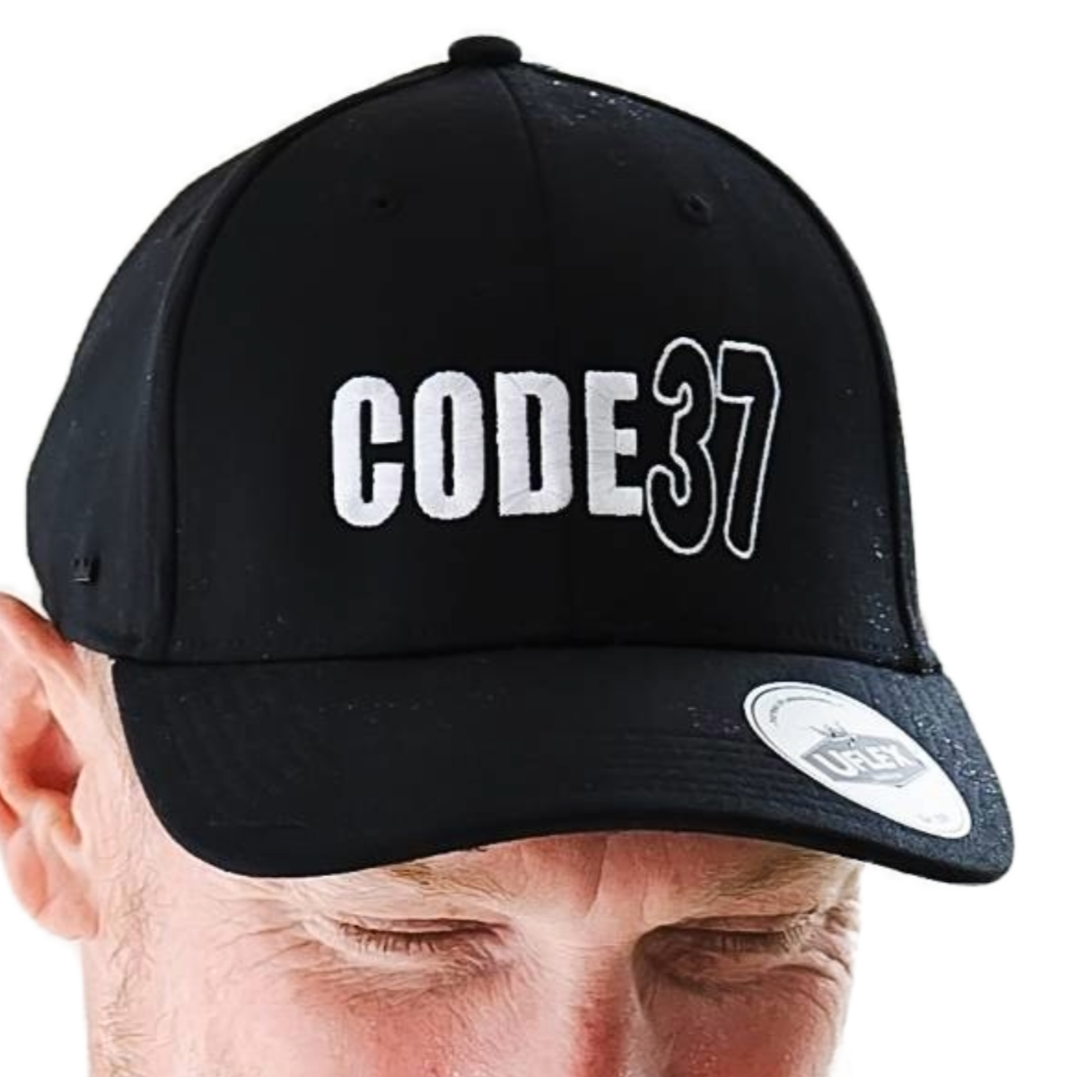 Black cap branded with 'CODE37' worn by a man.