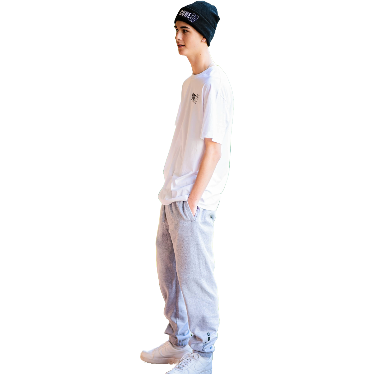 Person wearing a white t-shirt, grey pants, and a black beanie on a white background